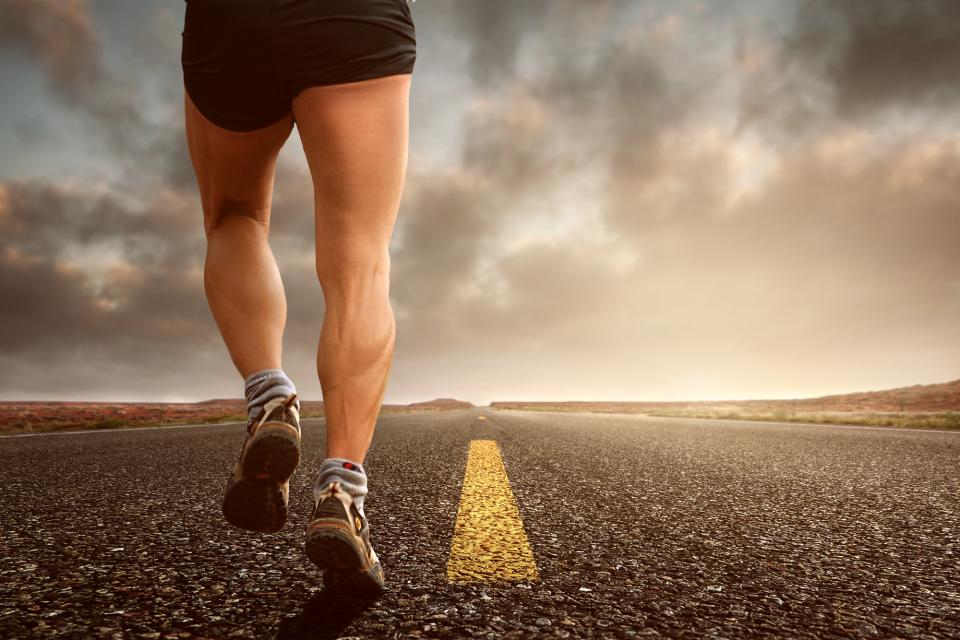 A runner's stride on an open road